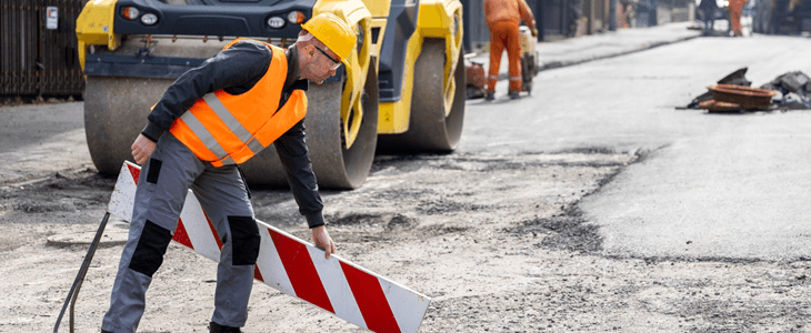 a construction working on a road project