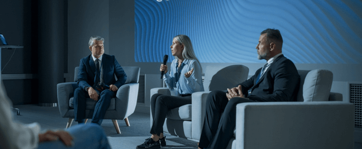 a panel of speakers at a convention