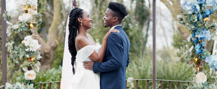 a bride and groom at the alter