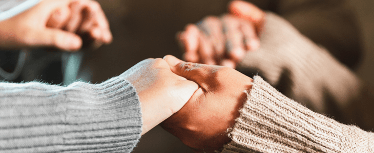 hands holding together in prayer